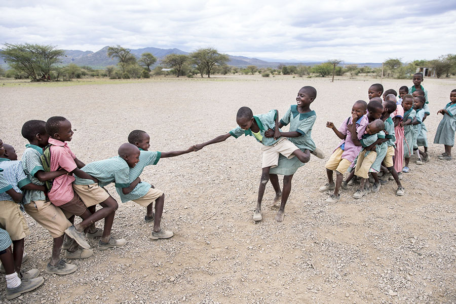 Students in Kenya play Tug of War. Photo by Jonathan Torgovnik/Reportage by Getty Images. All rights reserved.